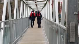 Illegal migrants walking ramp after being picked up by Border Force