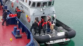 Migrants crossing English Channel brought ashore by UK Border Force