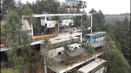 Abandoned buses transformed into guest houses on edge of cliff in southern China