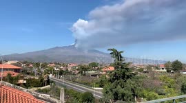 Trail of smoke lines Sicilian skyline as Mount Etna continues to erupt