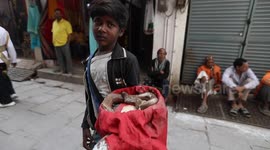 Youngest Snake Charmer Performing in the streets for his earning