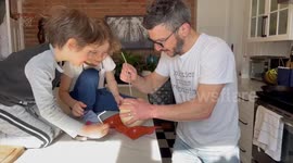 Canadian dad shows his kids how to empty an ostrich egg without cracking the shell