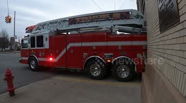 Ladder truck leaving the station for a call.