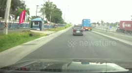 Car window flies into air and smashes while driving along road