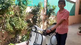 Teenager modifies petrol scooter into electric motor in central India