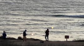 Fire Twirlers at Sunset in San Diego California 3/10/21