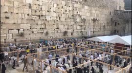 In Honor of New Month of Nissan, Jews Pray at Western Wall in Jerusalem in Special Capsules for COVID-19 Safety
