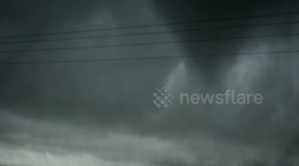 Powerful tornado swirls in northern Texas lifting debris into sky