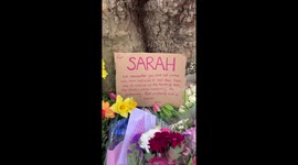 Signs protest the death of sarah everard at the vigil for her death on Clapham common