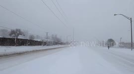 Man Walking Through Snow Storm In Denver Colorado