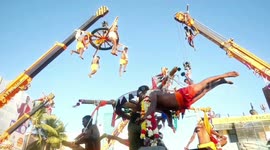 Gruesome festival in India sees worshippers insert hooks in their backs to hang from cranes