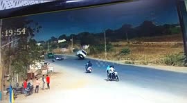 Car collided with a bike, ran over two tires, overturned and fell into a ditch in Western India.