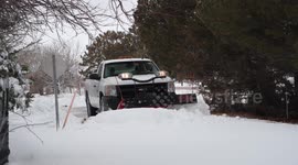Winter Storm Xylia batters Nebraska with snow as crews work to clean road