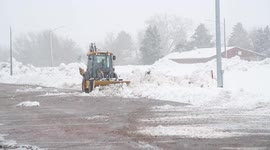 Snow Removal from Winter Storm Xylia as Snow Continues to Fall in Western Nebraska - Broadcast Ready