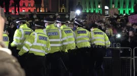 Sisters Uncut protesters heckle police outside New Scotland Yard before marching across London