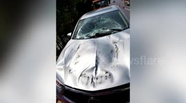 Loose tyre smashes into car's front windscreen after falling off truck on Chinese highway