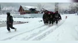 Army personnel help pregnant woman reach hospital amid snowfall in northern India