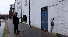 Mystery as Banksy-style mural appears in Birmingham showing a boy urinating on the artist's name