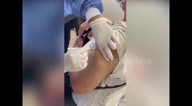 Colombian woman captures the moment her grandmother receives a COVID-19 'air vaccine'