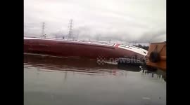 Disastrous moment brand new ship capsizes right after launch