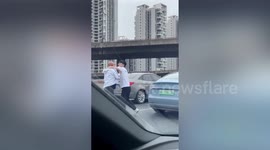 Two Chinese motorists detained for fighting on overpass after car collision