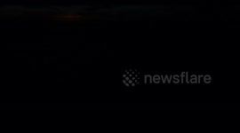 Sunrise over North Sea time-lapse. Blue sky and light cloud cover. 4K