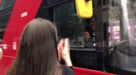 London bus driver honks horn and fist bumps anti-lockdown protesters