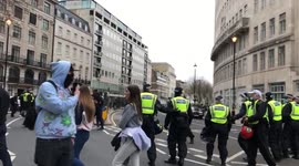 PORTLAND PLACE, LONDON - 20th March 2021: Protesters clashing with police outside the BBC Broadcasting Centre, during the Vigil For the Voiceless anti-lockdown protest