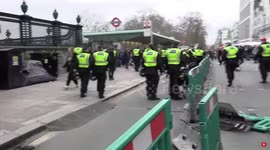 Newsflare Edit - London lockdown protesters jeer when police officer trips