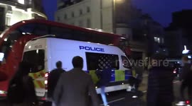 London lockdown protesters kick police vehicles and chase officers away