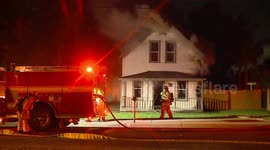 Two Story Home Heavily Damaged in Early Morning Fire