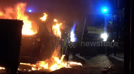 Police van and car destroyed during night of violence in Bristol