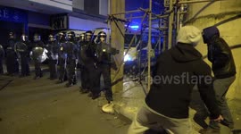 Protester throws CONCRETE breeze block at police during Bristol protest
