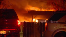 Multiple Vehicles, Carport and Apartment Building Damaged in Large Fire