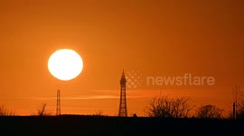 Watch stunning golden sunset behind Blackpool Tower on the Irish Sea coast of England