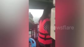 Terrified diners flee floating restaurant battered by unexpected storm