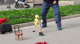 singing and dancing skeleton marionette puppet, by an old man puppeteer at Barcelona,Spain.