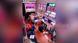 Quick-thinking son saves father from being hit by falling ladder in China