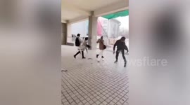 Extreme winds knock over pedestrians and rip roofs off houses in northwestern China