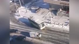 Utility pole narrowly misses man after bus knocks it over in northern China