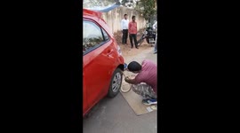 7-feet-long rat snake gets stuck in car's tyre in India