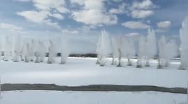 Chinese workers blow up frozen river to prevent build up of ice