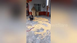 Talented man uses corn kernels to form 5-metre-long dragon in central China