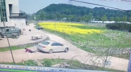 Elderly Chinese woman escapes serious injuries after being dragged underneath car
