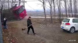 Chinese couple narrowly escape oncoming out-of-control truck