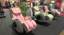 Full-body electric massage chairs displayed at Bangkok Motor Show