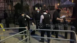 Climate change activist chained to entrance of Downing Street removed