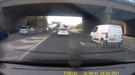 BMW idiot undertakes on hard shoulder.