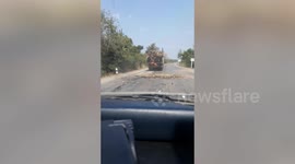 Furious driver chases truck spilling pieces of sugarcane onto road