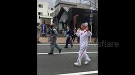 Small crowd attends Olympic torch relay in Fukushima amid COVID restrictions